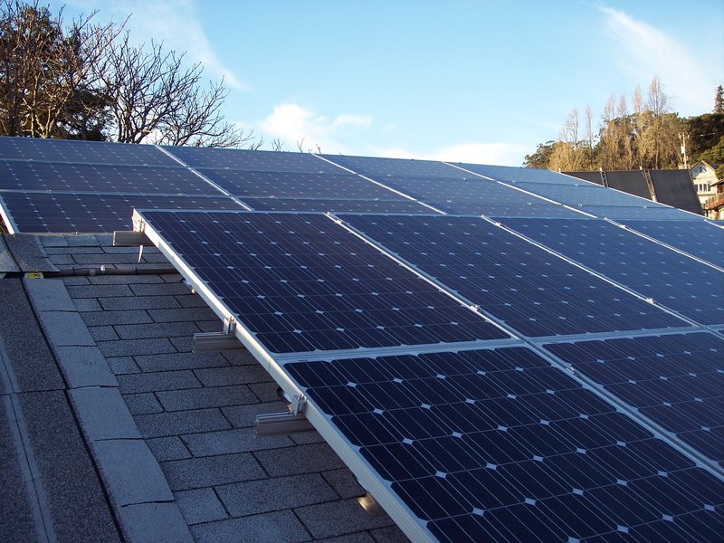 Solar panel mounting rails and roof rack system